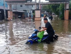 Hujan Deras Lumpuhkan Akses Jalan Paccerakkang, Bhabinkamtibmas Turun Bantu Pengendara